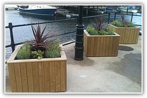 Decorative wooden planters supplied and installed by Lyndhurst Landscaping and Maintenance