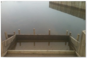 Dock refurbishment works, clearing the old dock of silt and buildup, reinforcing embankments and landscaping surrounding land.