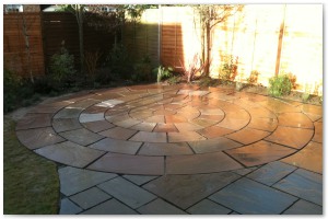 Indian sandstone patio and circular paving installation in Lymington, Hampshire