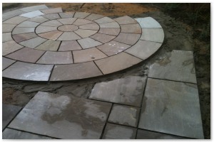 Indian sandstone patio and circular paving installation in Lymington, Hampshire