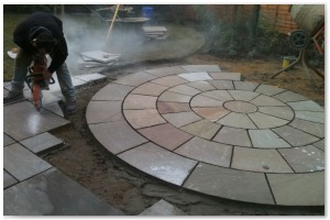 Indian sandstone patio and circular paving installation in Lymington, Hampshire