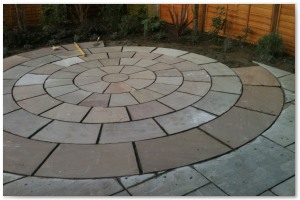 Indian sandstone patio and circular paving installation in Lymington, Hampshire