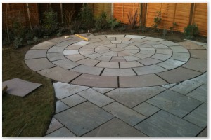 Indian sandstone patio and circular paving installation in Lymington, Hampshire