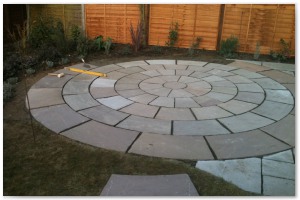 Indian sandstone patio and circular paving installation in Lymington, Hampshire