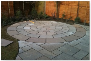 Indian sandstone patio and circular paving installation in Lymington, Hampshire