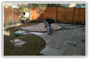 Indian sandstone patio and circular paving installation in Lymington, Hampshire