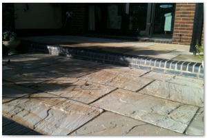 Multi level indian sandstone paving leading to waters edge at Hythe Marina, Hampshire