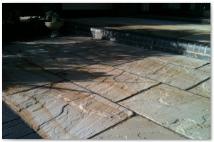 Multi level indian sandstone paving leading to waters edge at Hythe Marina, Hampshire