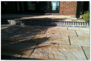 Multi level indian sandstone paving leading to waters edge at Hythe Marina, Hampshire