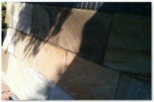 Multi level indian sandstone paving leading to waters edge at Hythe Marina, Hampshire