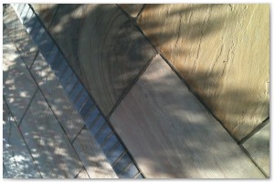Multi level indian sandstone paving leading to waters edge at Hythe Marina, Hampshire